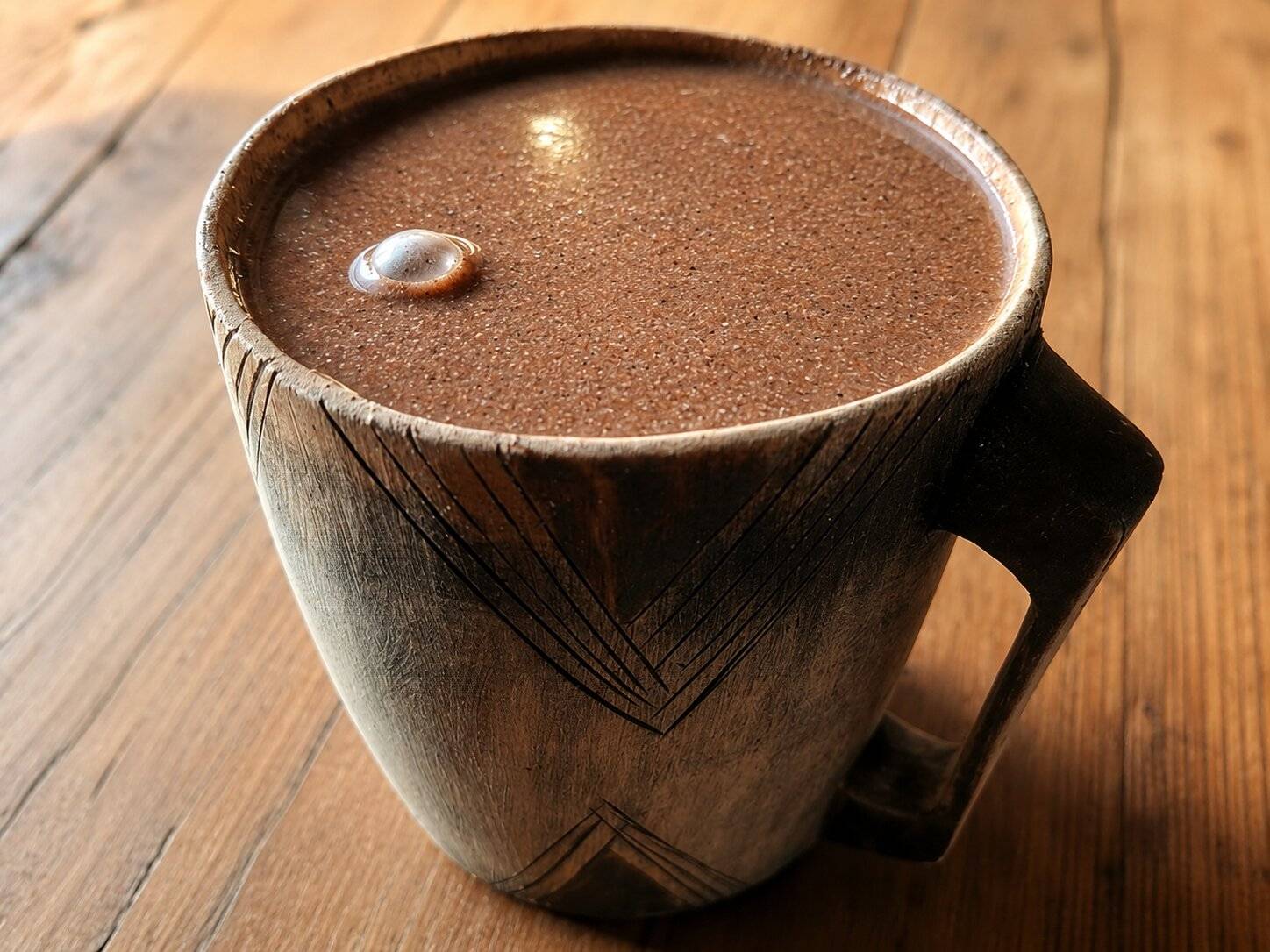 A warm cup of Ubushera at a table