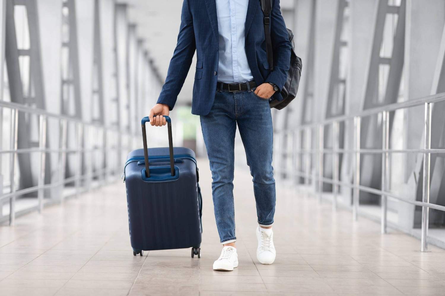 Man With Luggage At Airport Terminal
