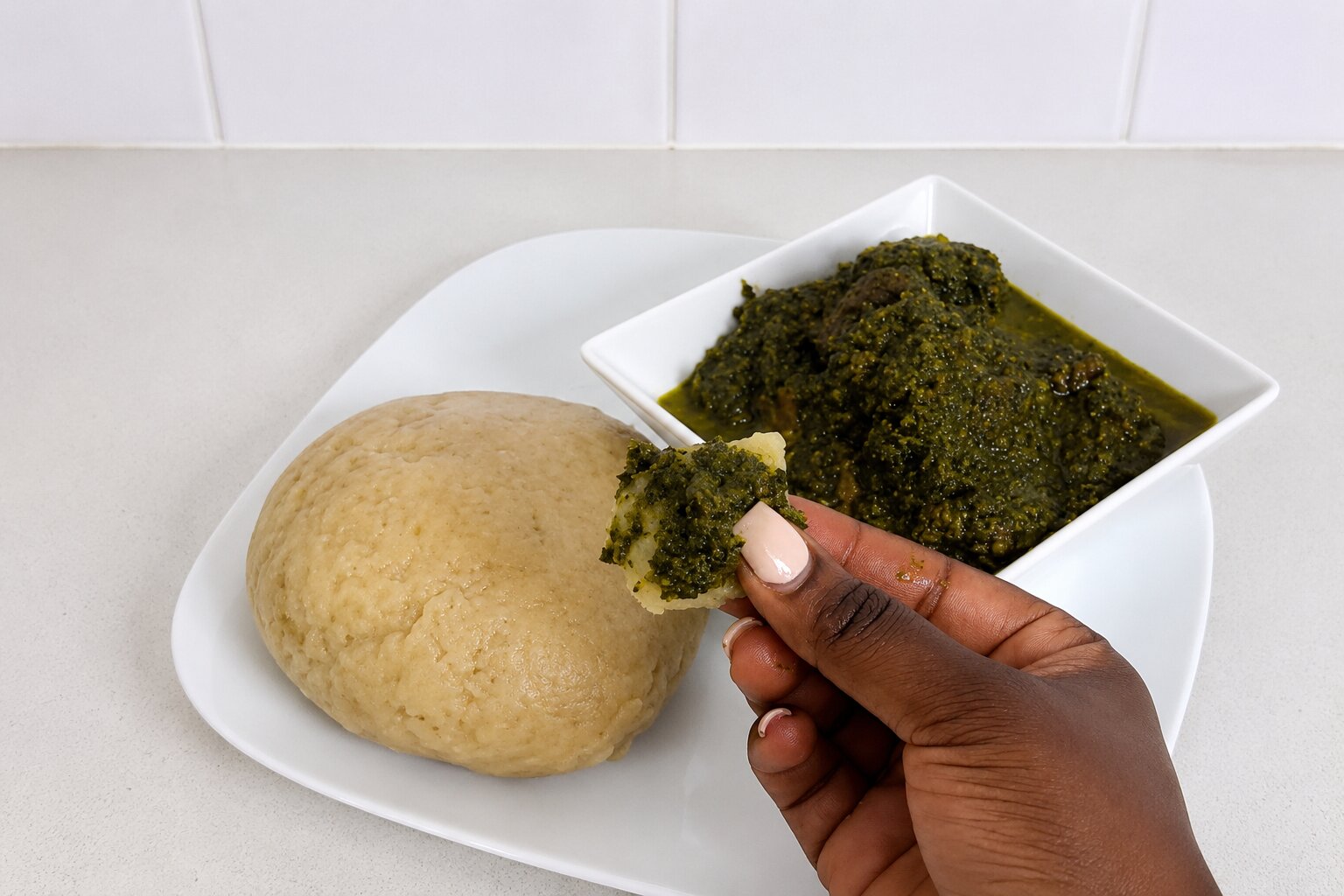 Person Having Some Isombe For Lunch